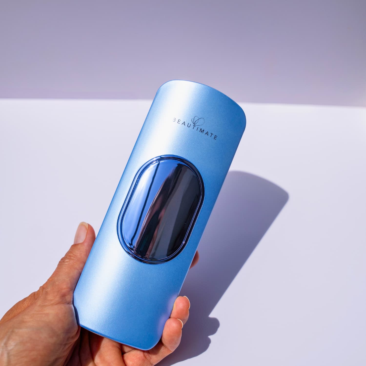 Using Beautimate IPL Hair Removal Device on leg with built-in ice-cooling feature